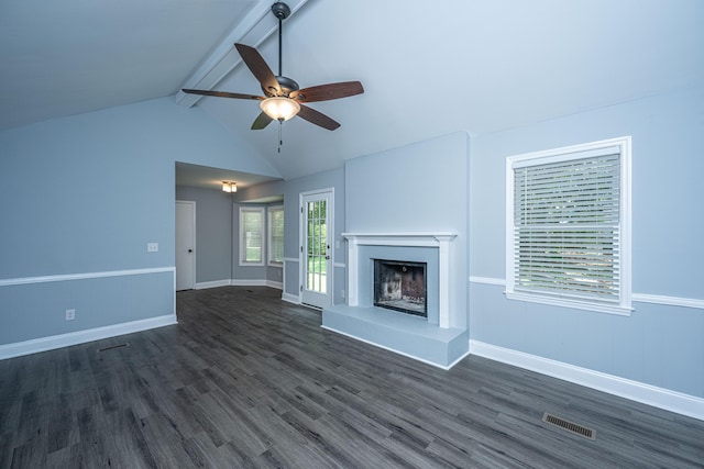 unfurnished living room with a ceiling fan, a fireplace with raised hearth, dark wood-type flooring, and baseboards