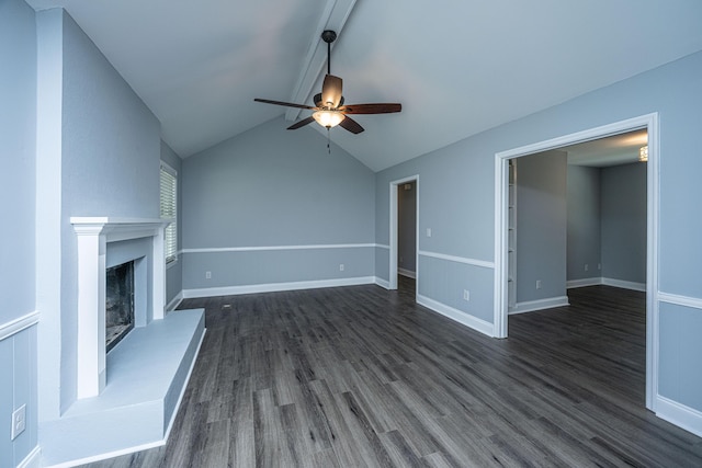 unfurnished living room featuring a ceiling fan, dark wood-type flooring, a fireplace with raised hearth, and baseboards