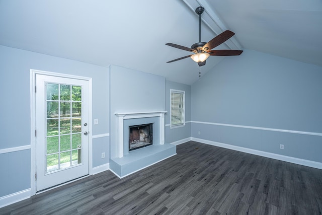 unfurnished living room with a fireplace with raised hearth, dark wood finished floors, ceiling fan, and baseboards