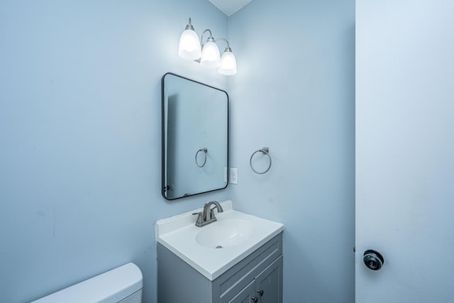 half bath with toilet and vanity