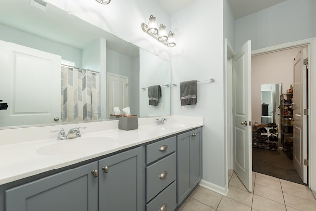 bathroom with vanity and tile patterned floors