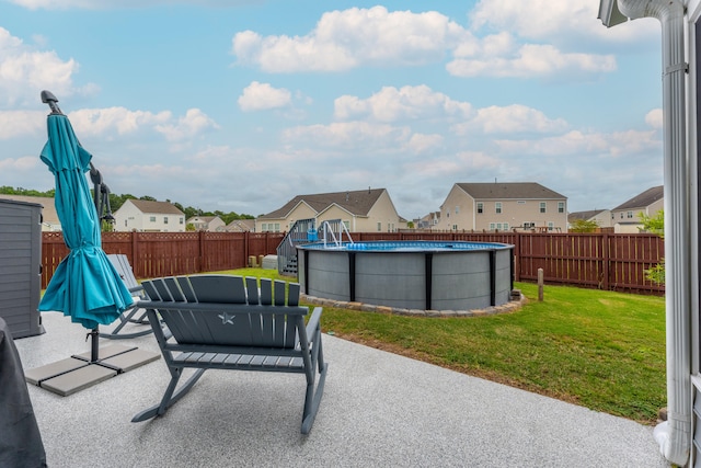 view of patio featuring a fenced in pool