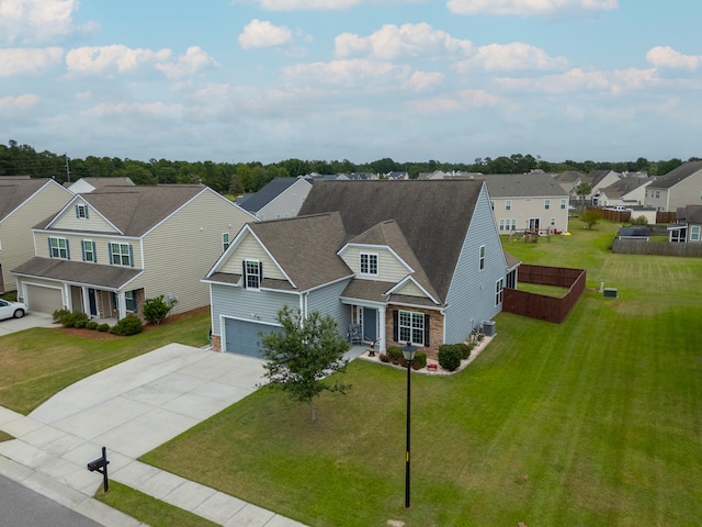 view of front of house with a garage and a front yard