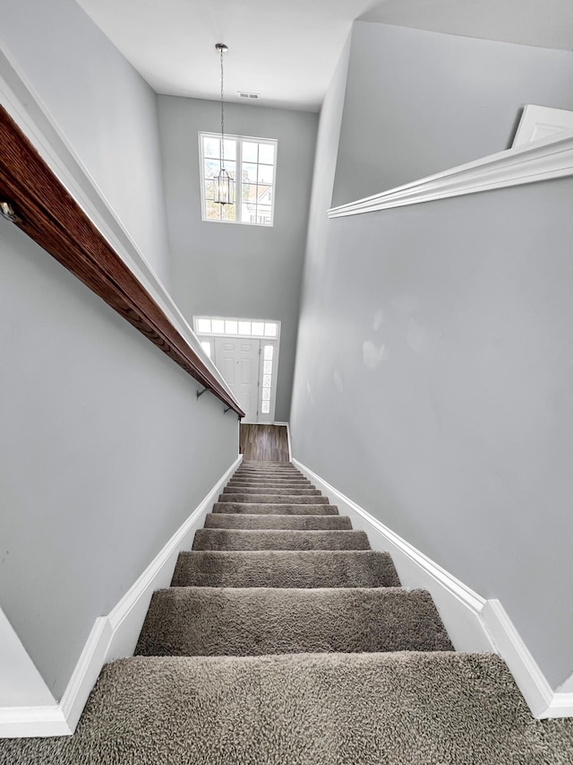 stairway with a towering ceiling