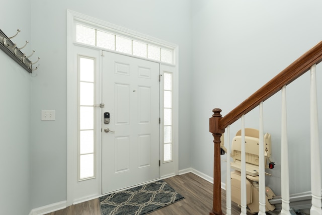 entryway with dark wood-type flooring and a healthy amount of sunlight