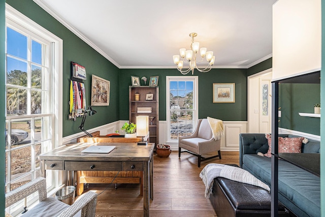 interior space featuring a wainscoted wall, a wealth of natural light, and crown molding