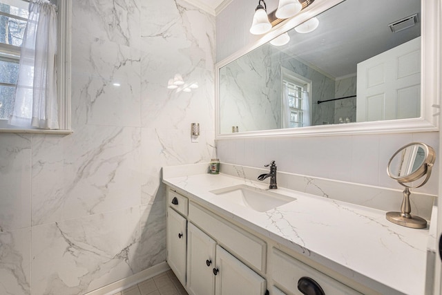 full bathroom with a shower, visible vents, and vanity