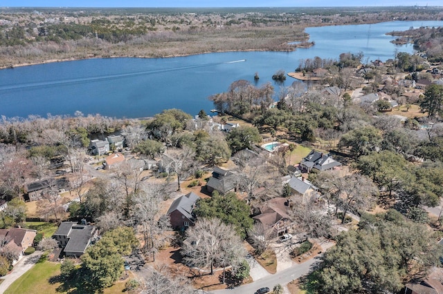 drone / aerial view with a water view and a residential view