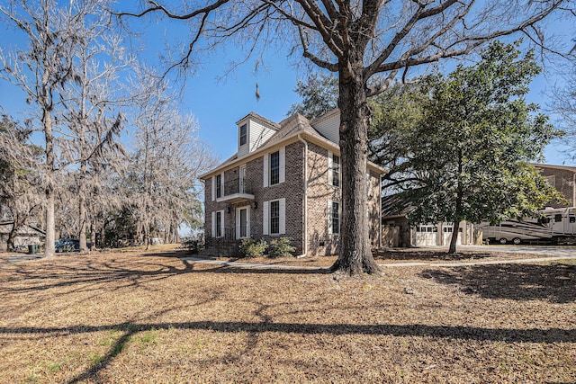 view of front of property featuring brick siding