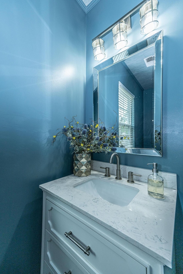 bathroom with vanity and visible vents