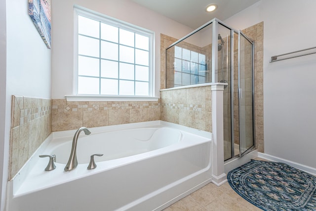 bathroom featuring tile patterned flooring, a stall shower, recessed lighting, and a bath