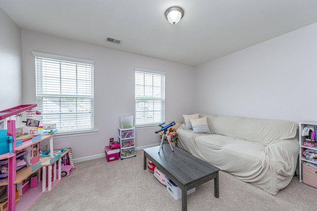 carpeted bedroom with baseboards and visible vents