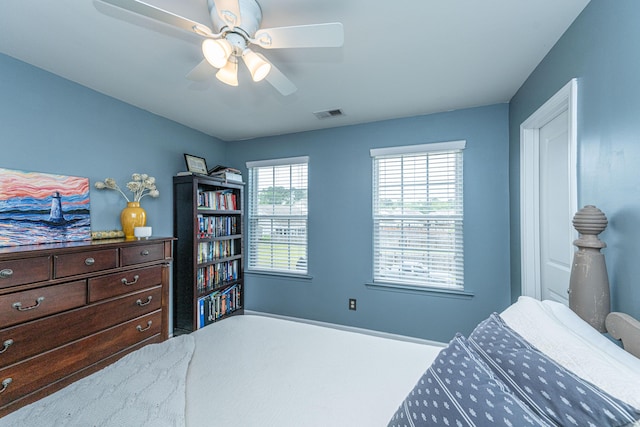 bedroom with a ceiling fan and visible vents