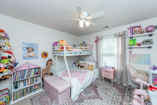 bedroom with visible vents, carpet floors, and ceiling fan