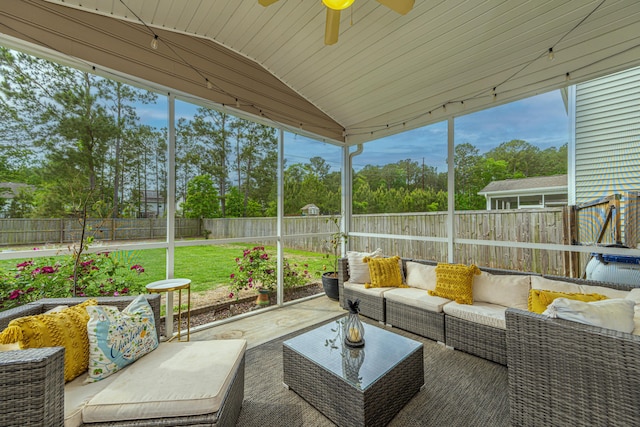 sunroom featuring a ceiling fan and an outdoor hangout area