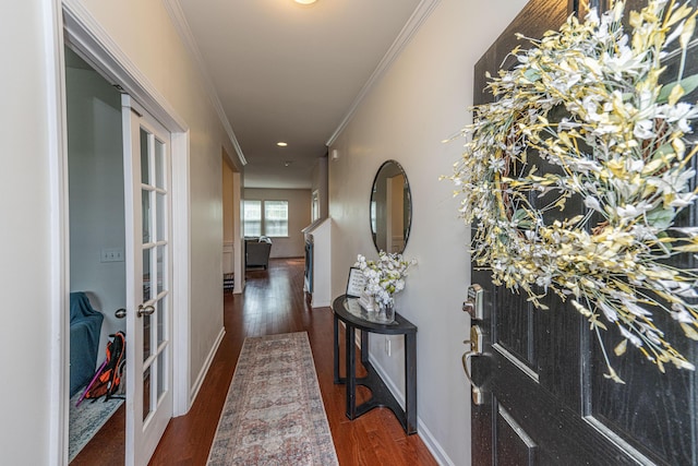 hallway with ornamental molding, wood finished floors, baseboards, recessed lighting, and french doors