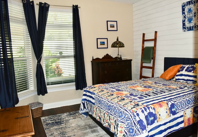 bedroom featuring dark hardwood / wood-style flooring