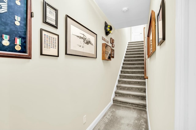 stairs with carpet flooring