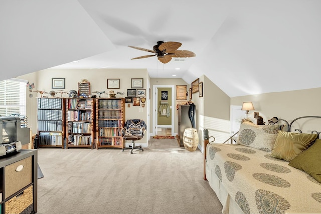 bedroom featuring ceiling fan, lofted ceiling, and light carpet