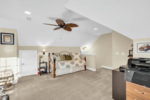 bedroom featuring light colored carpet, vaulted ceiling, and ceiling fan