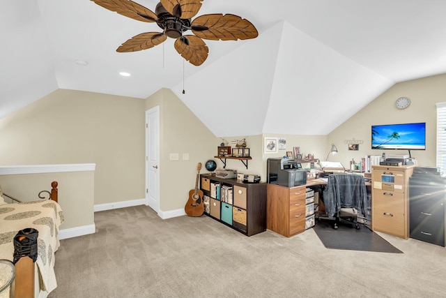 carpeted office space with vaulted ceiling and ceiling fan