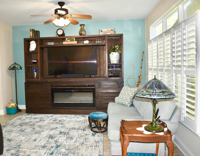 living room featuring tile patterned flooring and ceiling fan