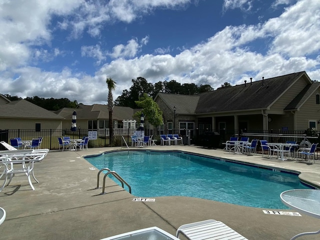 view of swimming pool featuring a patio area