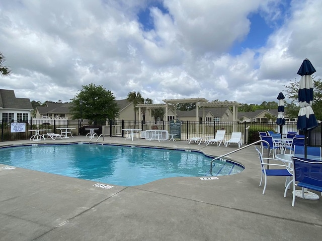 view of swimming pool with a pergola and a patio area