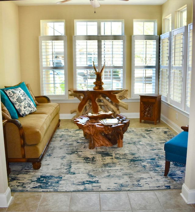 sunroom with ceiling fan