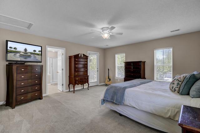 30 Regency Oaks Dr, Summerville, SC 29485 - bedroom with multiple windows, light colored carpet, baseboards, ceiling fan, and a textured ceiling