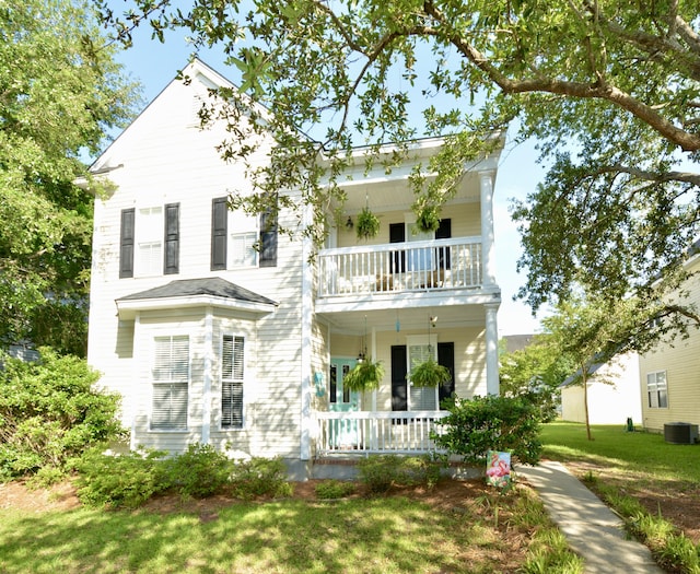 30 Regency Oaks Dr, Summerville, SC 29485 - view of front facade with a balcony, covered porch, central AC unit, and a front lawn