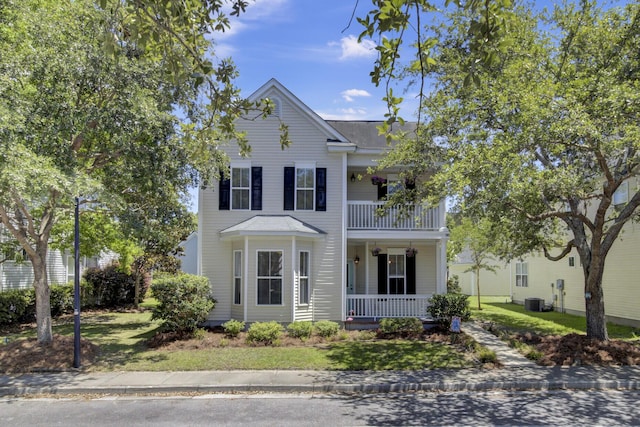 30 Regency Oaks Dr, Summerville, SC 29485 - view of front of property with a porch, a balcony, a front yard, and central AC unit
