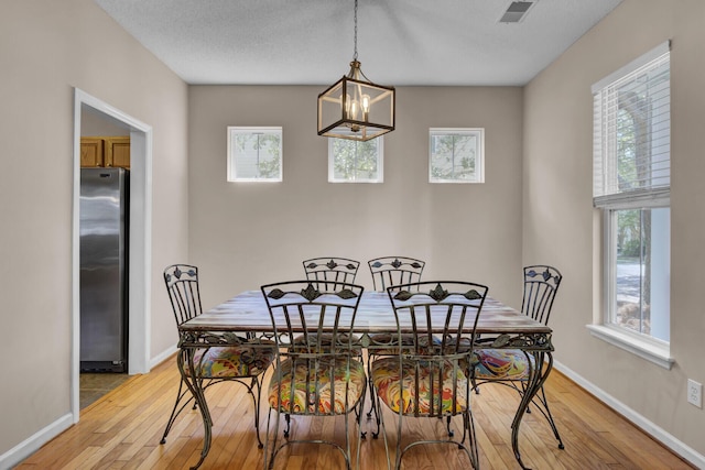 30 Regency Oaks Dr, Summerville, SC 29485 - dining space with light wood-style flooring, a chandelier, and plenty of natural light