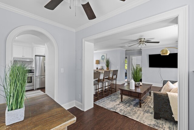 1324 Maxwell St, North Charleston, SC 29405 - living room featuring dark wood-style flooring, a ceiling fan, crown molding, and baseboards