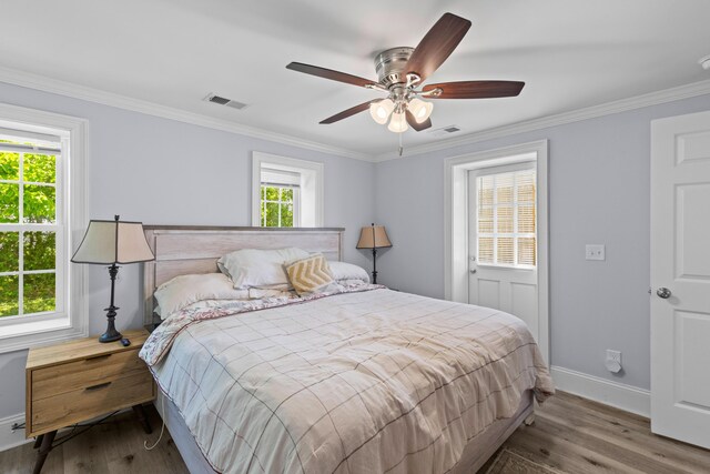 1324 Maxwell St, North Charleston, SC 29405 - bedroom with wood finished floors, visible vents, and crown molding