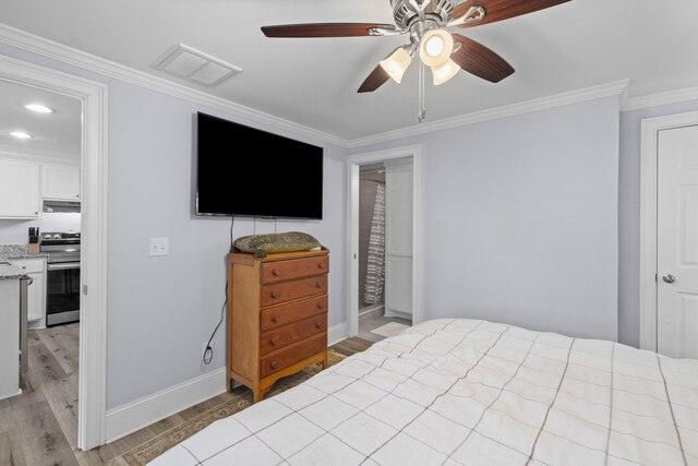 1324 Maxwell St, North Charleston, SC 29405 - bedroom with baseboards, crown molding, visible vents, and light wood-style flooring