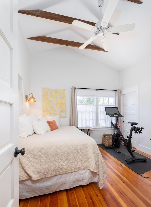 bedroom with ceiling fan, hardwood / wood-style flooring, high vaulted ceiling, and beamed ceiling