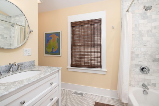 bathroom with shower / bath combo with shower curtain, vanity, and tile patterned flooring