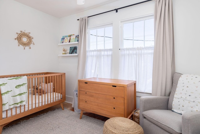 bedroom featuring a nursery area