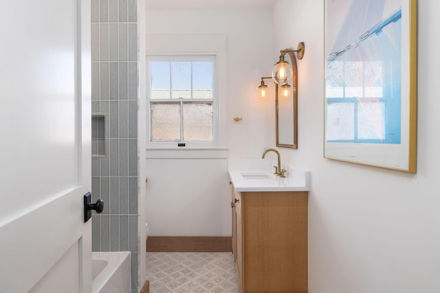 bathroom with toilet, vanity, and a tub to relax in