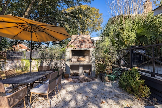 view of patio featuring exterior fireplace