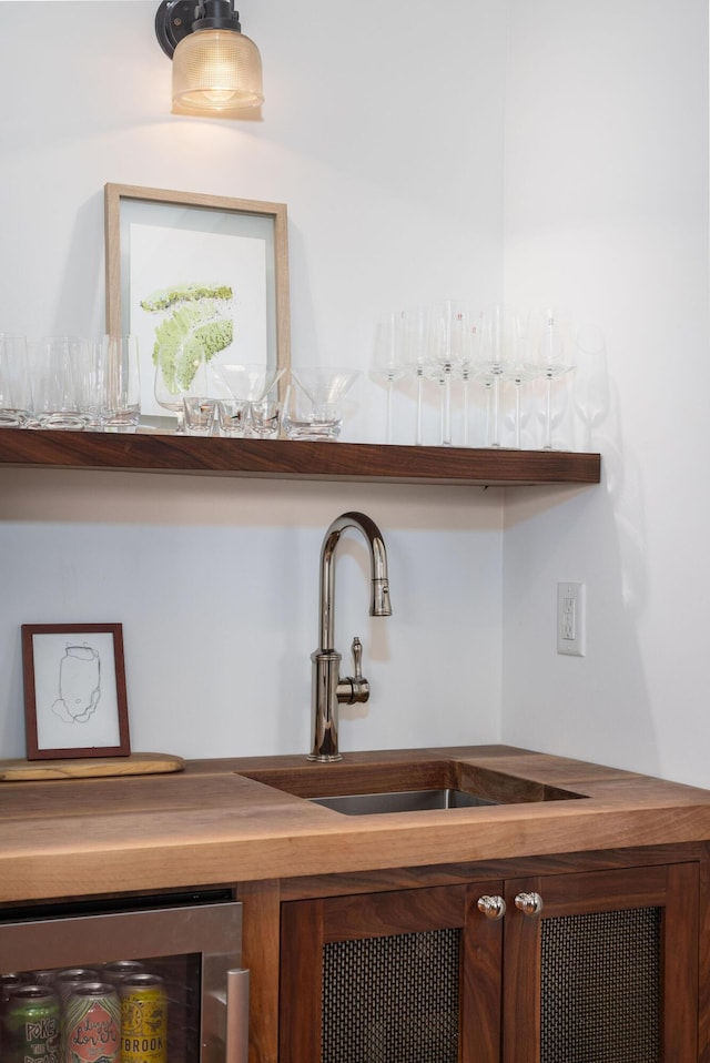 interior details with wine cooler and wet bar