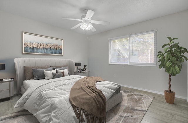 bedroom featuring ceiling fan and light wood-type flooring