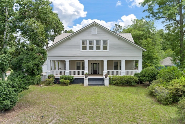 view of front of house featuring covered porch and a front yard