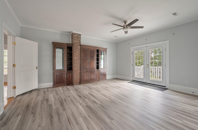 unfurnished living room featuring crown molding, french doors, brick wall, light hardwood / wood-style flooring, and ceiling fan