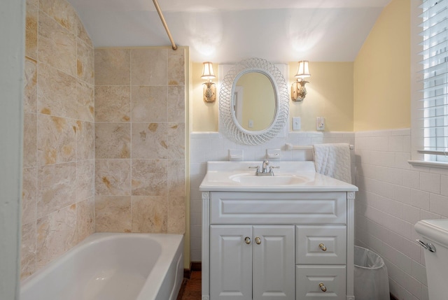 full bathroom with tasteful backsplash, vanity, toilet, and tile walls