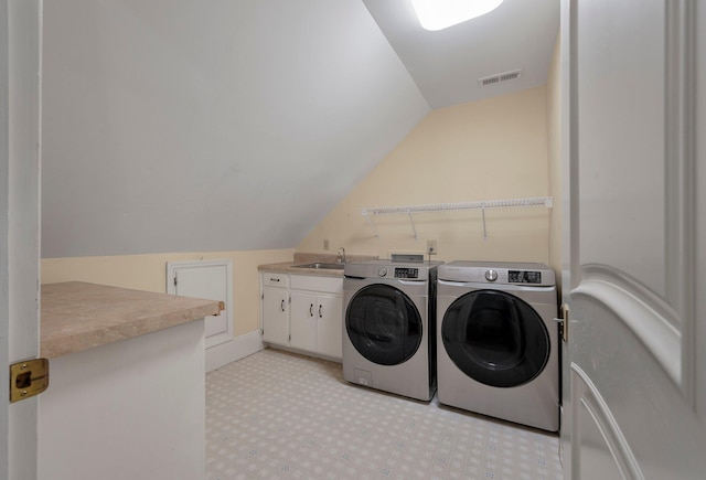 washroom with separate washer and dryer, sink, cabinets, and washer hookup