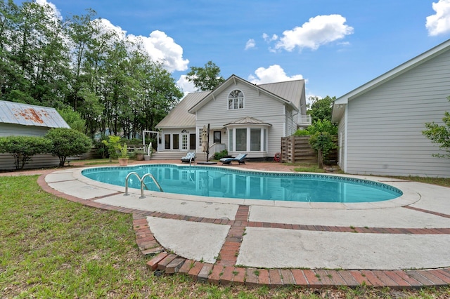 view of pool featuring a patio area