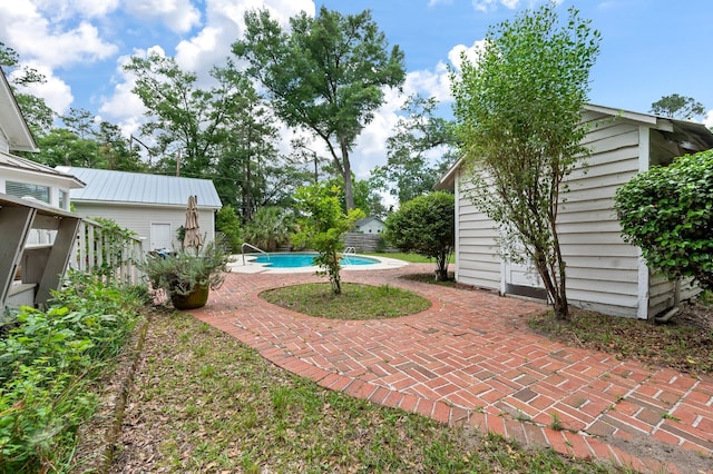 view of yard with a patio area and an outdoor structure