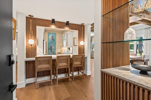 4943 Green Dolphin Way, Kiawah Island, SC 29455 - bar with wood finished floors, plenty of natural light, and baseboards